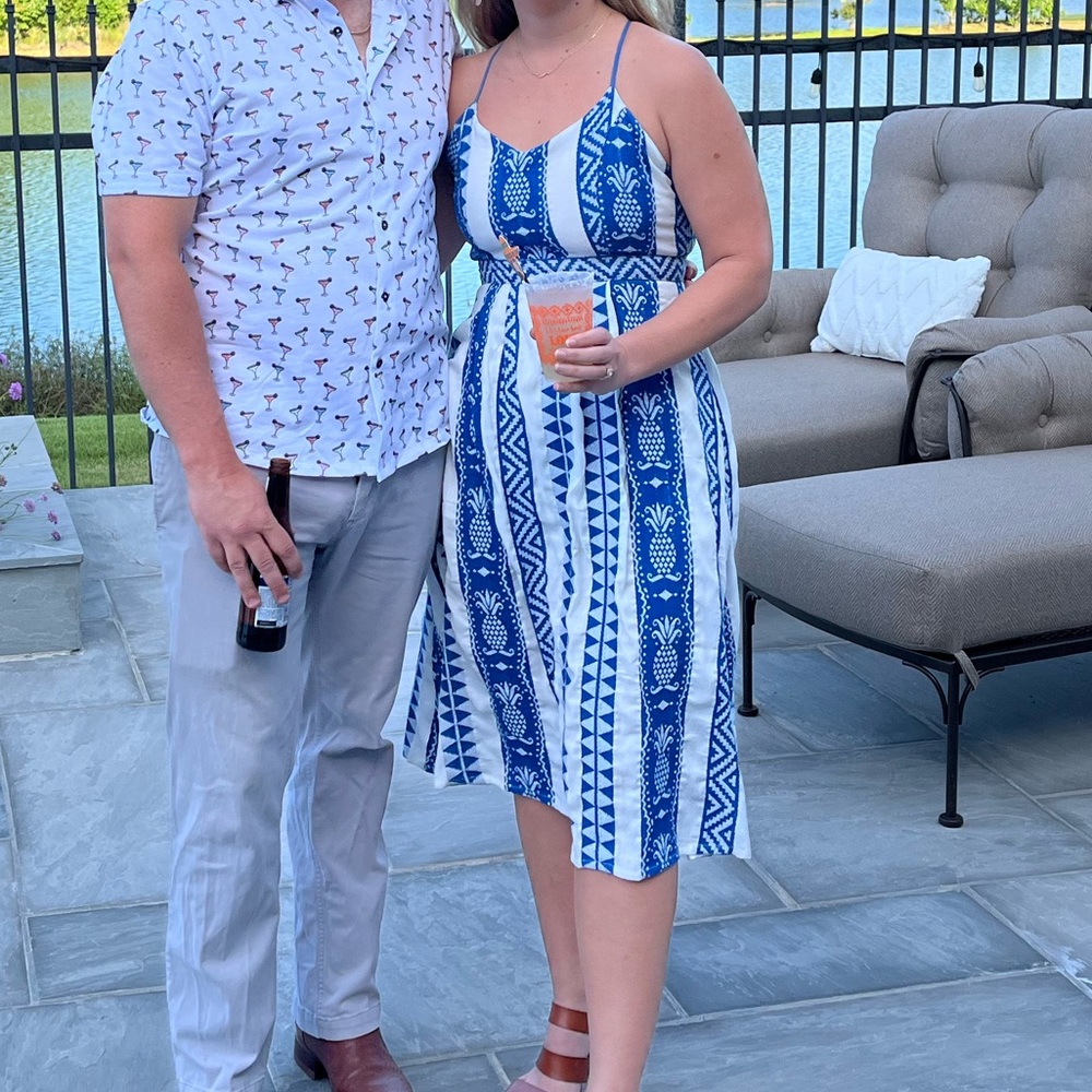 Size M blue and white embroidered dress. Cute cross back detail. Worn once